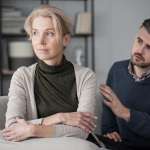 Husband apologising to his offended wife