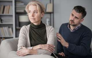 Husband apologising to his offended wife