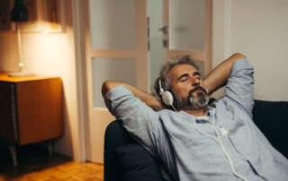 Image of a man listening music with headphones accompanying family law article "Getting a Divorce - What About 'Fault'?"