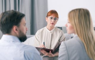 Mediator talking to a couple during a session