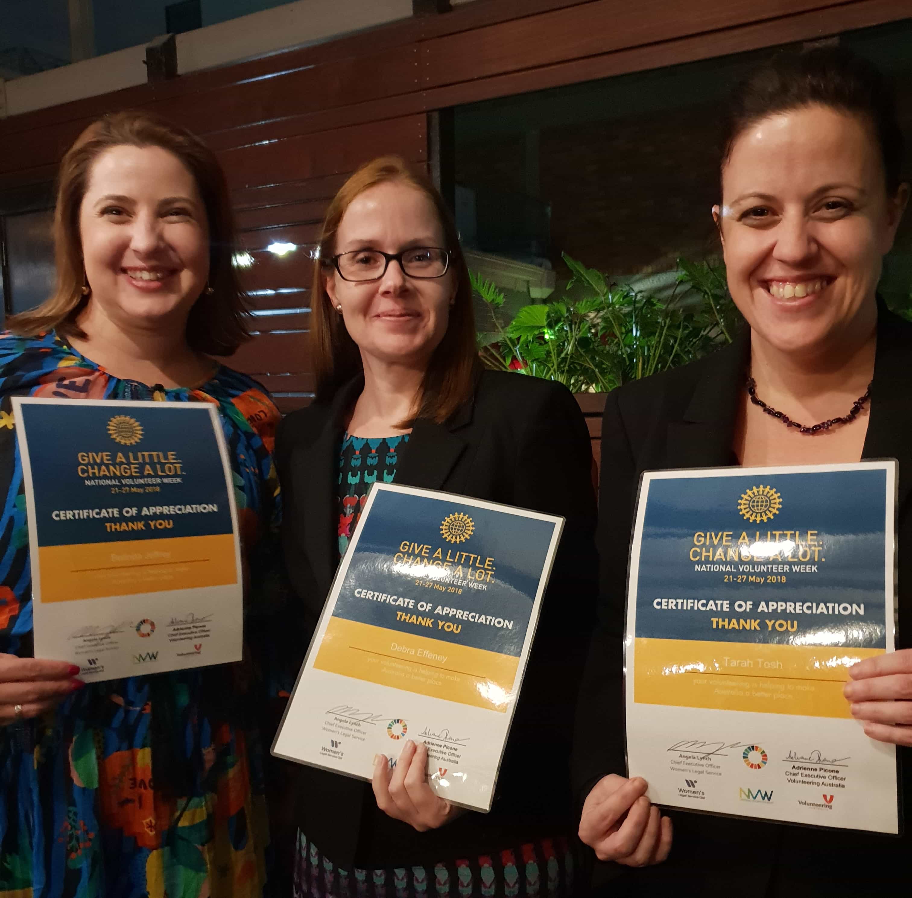 A photo of Belinda, Debra and Tarah with certificates 'Give a little change a lot"