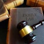 A photo of a book with a title "Family Law" and a gavel