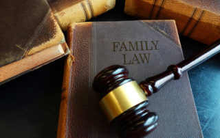 A photo of a book with a title "Family Law" and a gavel