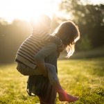 A photo of two children playing outdoors
