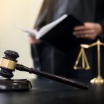 gavel and soundblock of justice law and lawyer working on wooden desk background.