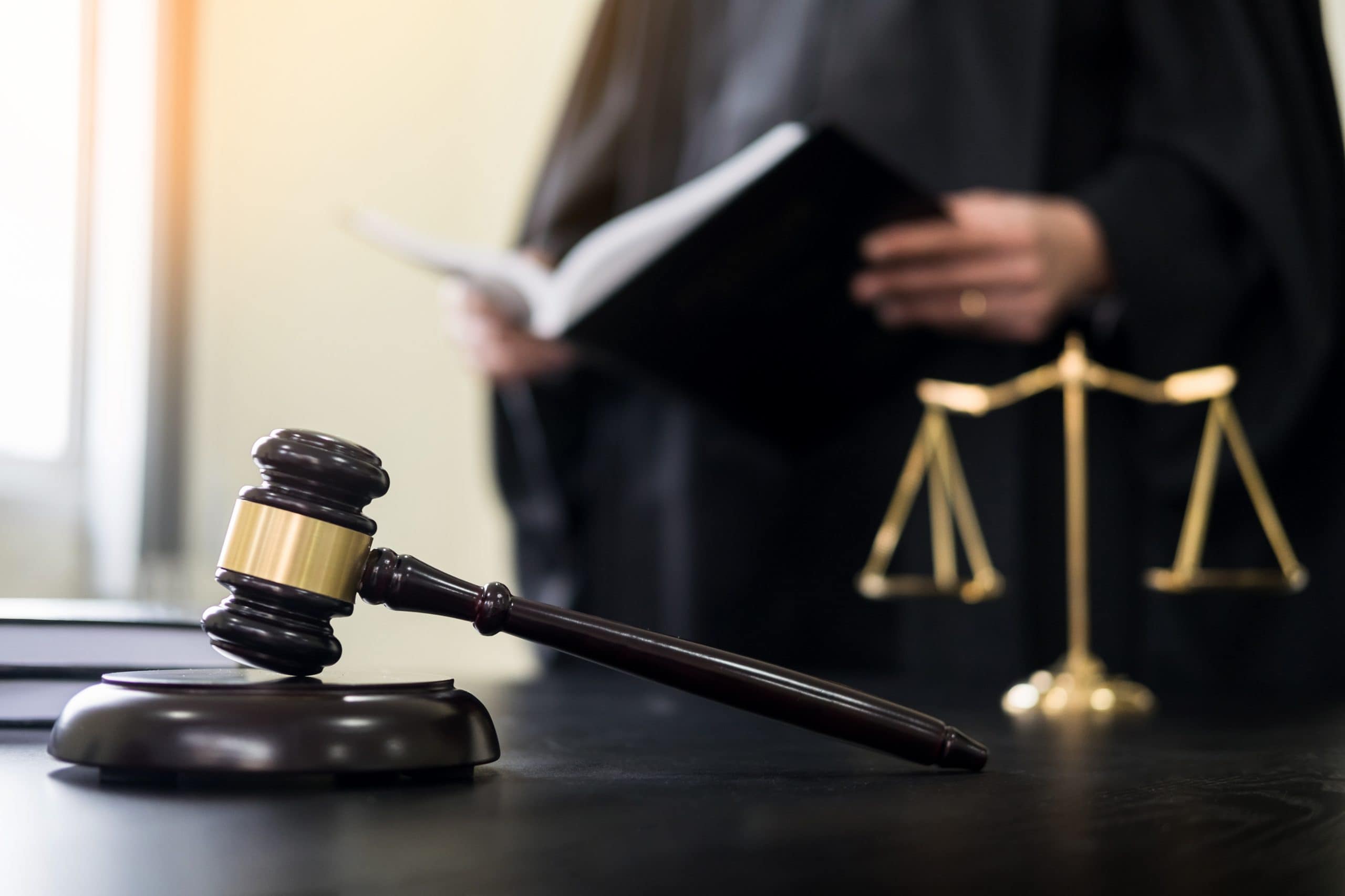 gavel and soundblock of justice law and lawyer working on wooden desk background.