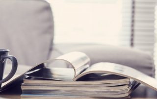 Photo of a pile of papers on a work desk