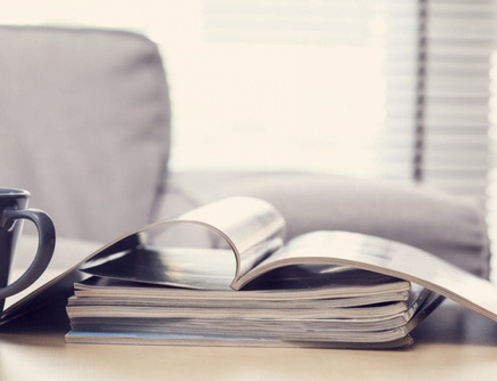 Photo of a pile of papers on a work desk