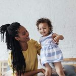 Image of a mother and daughter on a couch