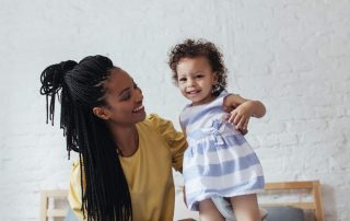 Image of a mother and daughter on a couch