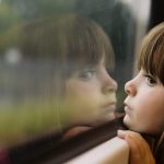Photo of a girl looking out the window