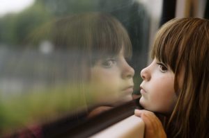 Photo of a girl looking out the window