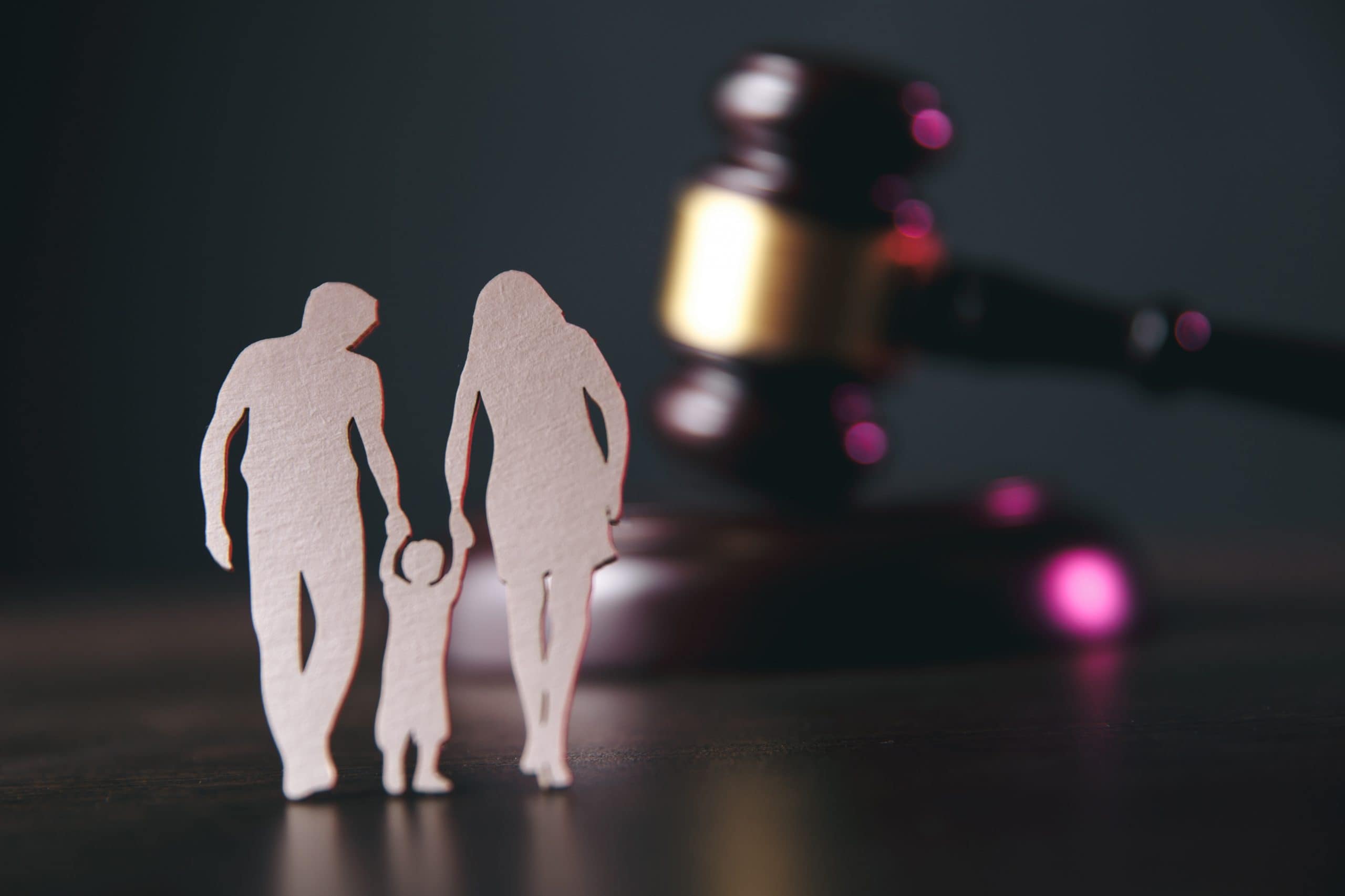COVID-19: Family Law Legal Tips. Accompanying picture: Family figure and gavel on table
