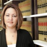 COVID-19: What are the courts doing? Accompanying picture: woman in law library