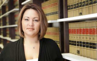 COVID-19: What are the courts doing? Accompanying picture: woman in law library