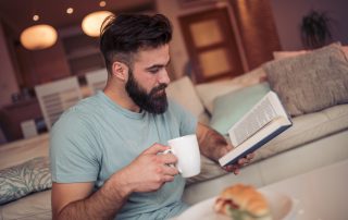 COVID-19: health and wellbeing. Accompanying picture: Man reading a book