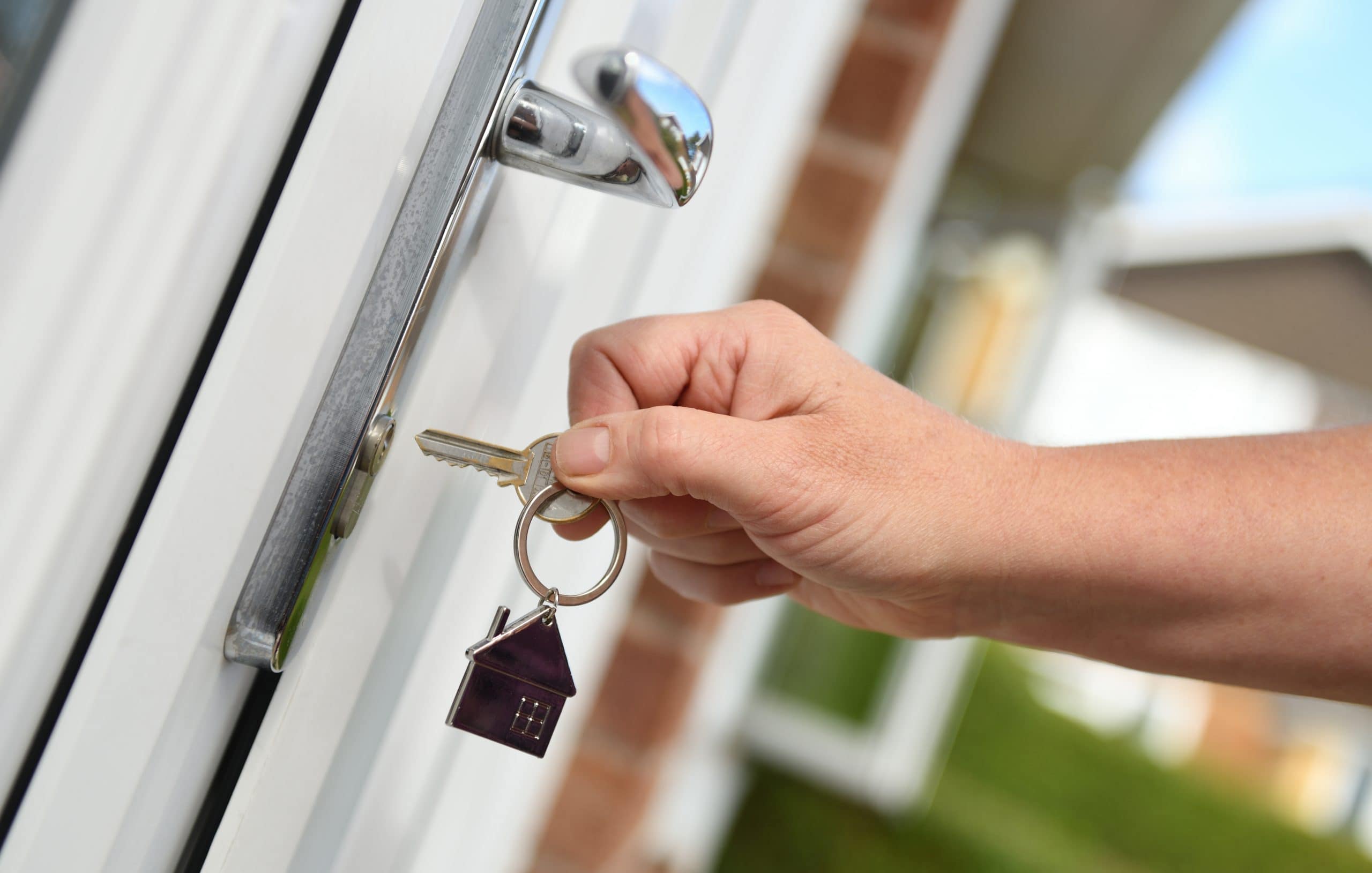 Who Stays In The House? Accompanying image: opening a door to house with key
