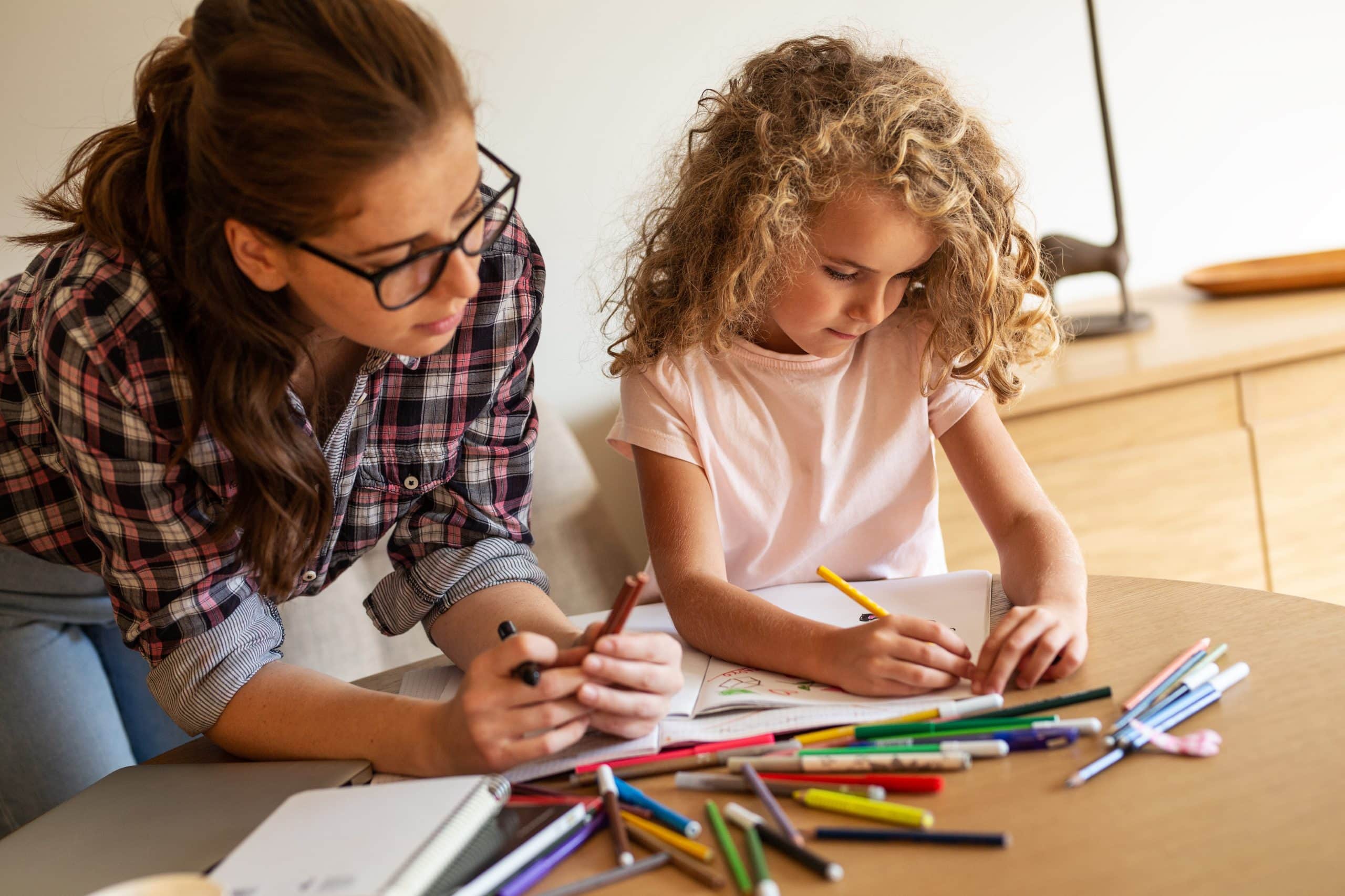 COVID-19 – Back to school and school holidays already. Accompanying image: mother and daughter drawing together at home