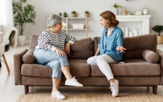 Helping your kids financially – what if they divorce? Accompanying picture: mother and daughter speaking on couch
