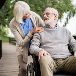 When aged care comes between couples. Accompanying picture: nice senior woman with husband in wheelchair in park