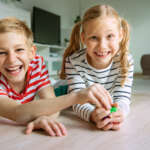 Image of two children, accompanying family law article "Shared parenting v parallel parenting"