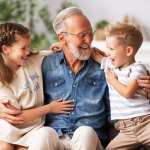 Image of a grandfather with his grandchildren, accompanying family law article "Grandparent rights - a grey area"