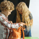 Image of siblings accompanying the family law article "Five nights or seven"