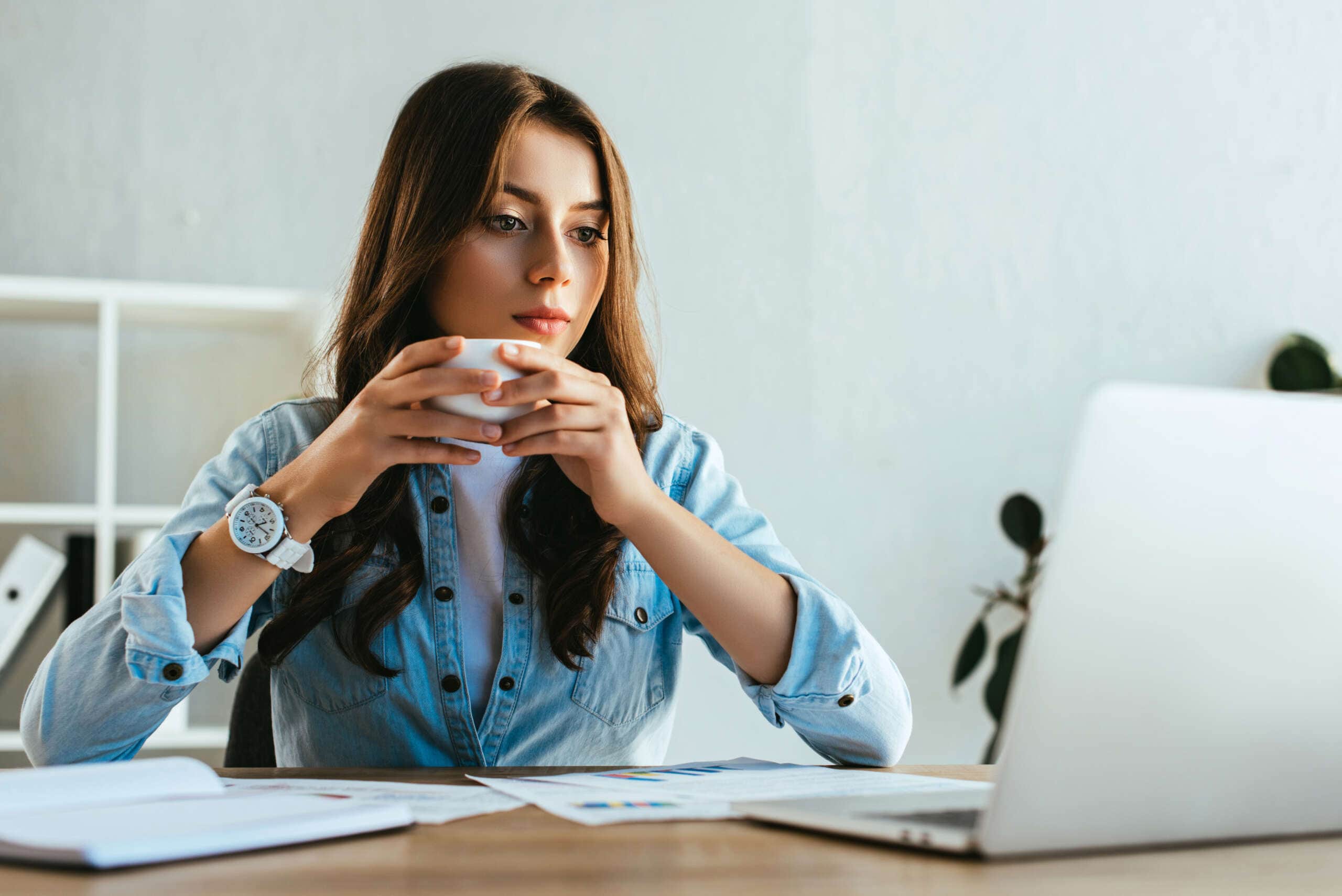 Image of a woman with cup of coffee