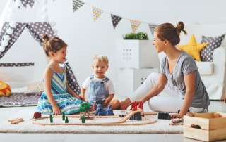 Image children and their mother, accompanying family law article "Can I change my parenting Court order?"