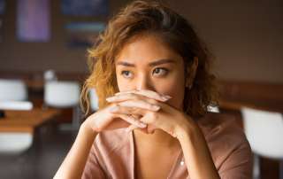 Image of a sad woman accompanying family law article "Understanding domestic violence laws"