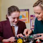 Image of a student and her teacher accompanying family law article "Teachers are head of the class for helping kids"