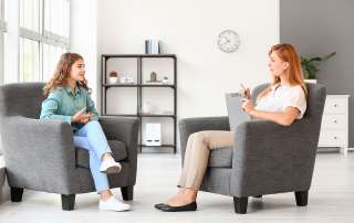 Image of a young female at a consultation with a counsellor,