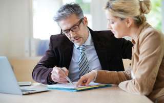 Image of a man and woman solving a problem, accompanying family law article "What is an Appeal?"