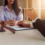 Image of a lawyer and his client, accompanying family law article "Paths to getting a property settlement"