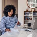 Image of a female going through paperwork, accompanying family law article "The Treatment of Long Service Leave"