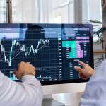 Image of two smart brokers, accompanying family law article "What about the crypto?"