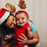 Image of a mother with her baby, accompanying family law article "Coping with christmas – tips for separated families"