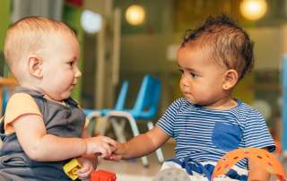 Image of two babies, accompanying family law article "Do overseas parenting orders apply here?"